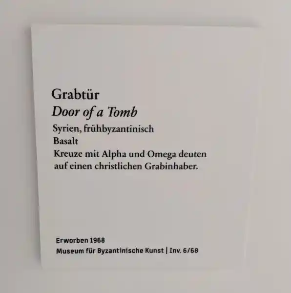 Description, interpret crosses with alpha and omega on a Christian grave owner, cross on a basalt tomb door, located in Bode Museum.